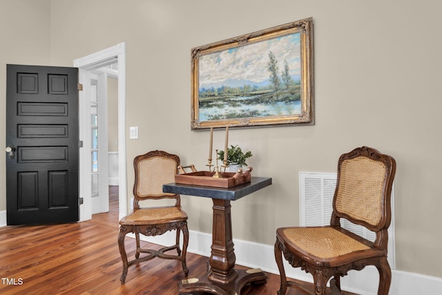 210 E Trinity Ave, Durham, NC 27701 - living area featuring wood finished floors and baseboards