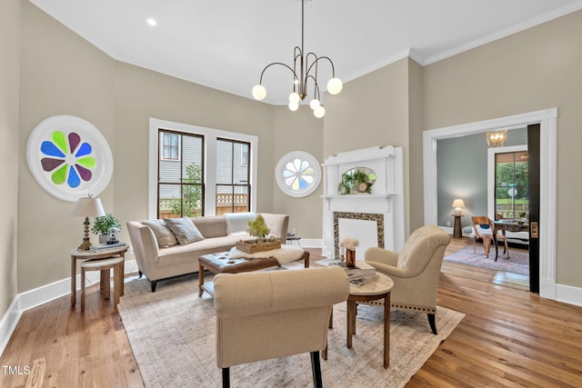 210 E Trinity Ave, Durham, NC 27701 - living room featuring ornamental molding, a chandelier, light wood-style floors, and a high end fireplace