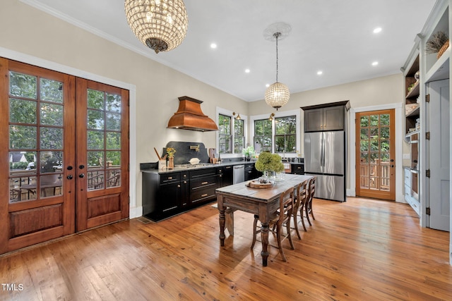 210 E Trinity Ave, Durham, NC 27701 - kitchen featuring stainless steel appliances, custom range hood, french doors, light wood-style floors, and crown molding