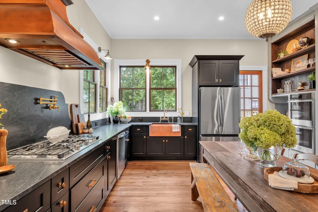 210 E Trinity Ave, Durham, NC 27701 - kitchen with custom range hood, appliances with stainless steel finishes, light wood-style floors, open shelves, and crown molding