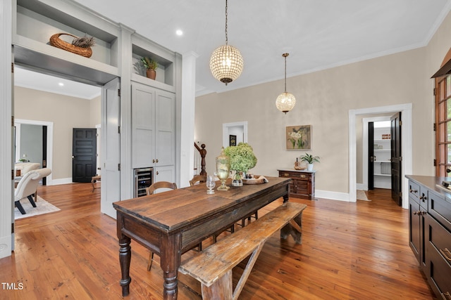 210 E Trinity Ave, Durham, NC 27701 - dining space with ornamental molding, light wood-style floors, and recessed lighting
