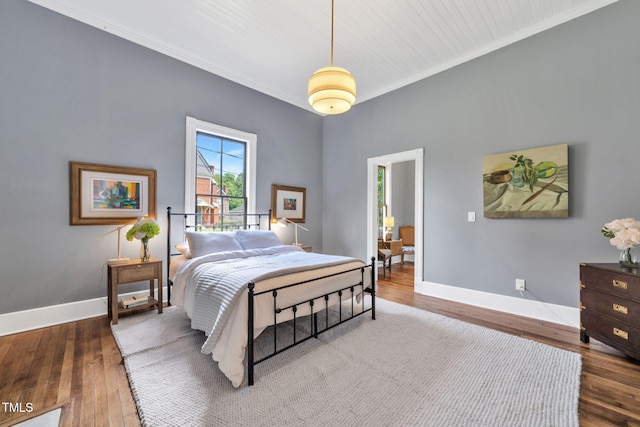 210 E Trinity Ave, Durham, NC 27701 - bedroom with crown molding and wood finished floors