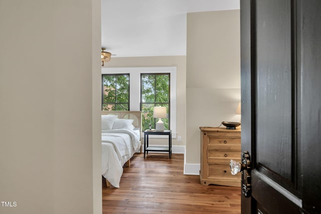 210 E Trinity Ave, Durham, NC 27701 - bedroom featuring wood-type flooring and baseboards