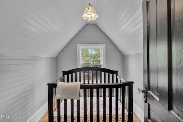 210 E Trinity Ave, Durham, NC 27701 - bedroom featuring vaulted ceiling and wood finished floors