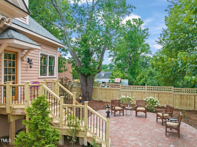 210 E Trinity Ave, Durham, NC 27701 - fenced backyard with a patio and stairway