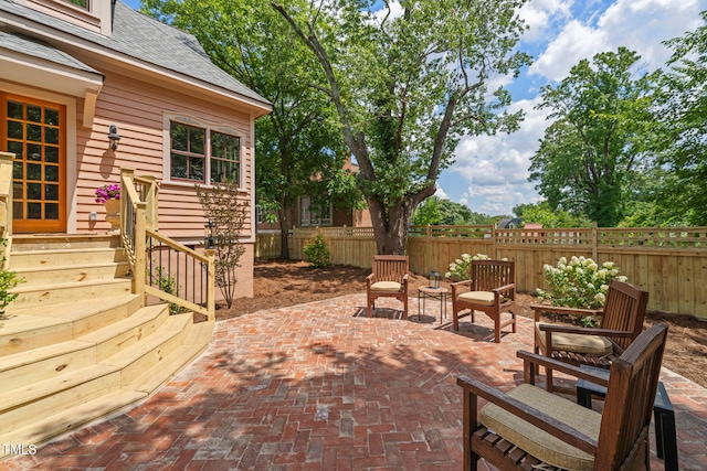 210 E Trinity Ave, Durham, NC 27701 - fenced backyard with entry steps and a patio area