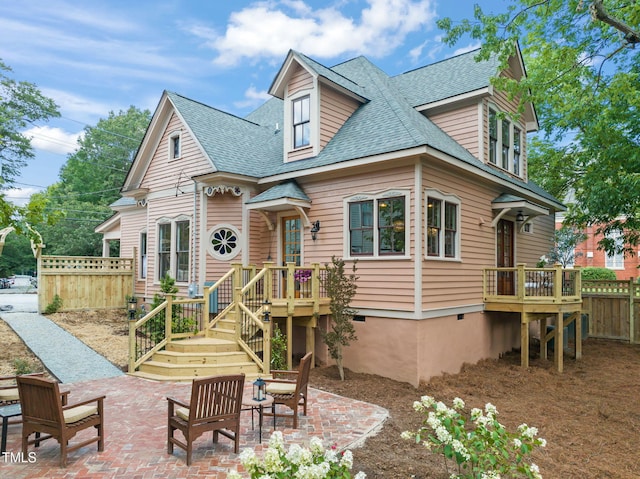 210 E Trinity Ave, Durham, NC 27701 - view of front of home with a shingled roof and a patio