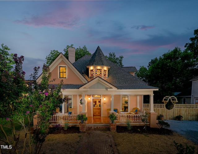 210 E Trinity Ave, Durham, NC 27701 - victorian house featuring covered porch, a shingled roof, and a chimney