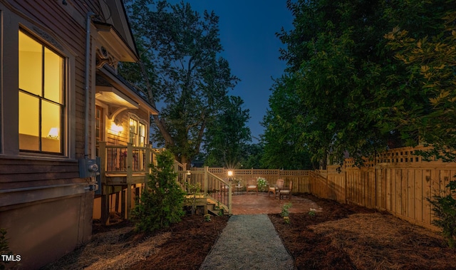 210 E Trinity Ave, Durham, NC 27701 - fenced backyard featuring a patio