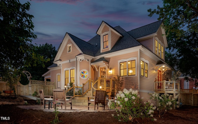 210 E Trinity Ave, Durham, NC 27701 - view of front facade with a shingled roof and a patio