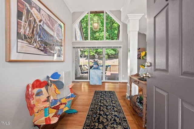 104 Cedar Ridge Way, Durham, NC 27705 - entrance foyer with wood finished floors, crown molding, and ornate columns