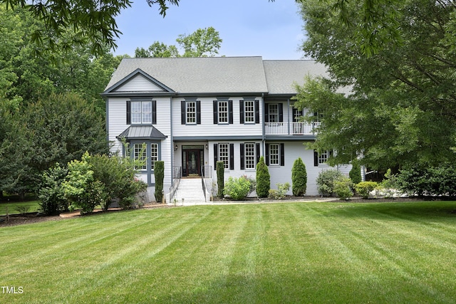 4217 Grahamstone Rd, Raleigh, NC 27610 - view of front of property with a front lawn and a balcony
