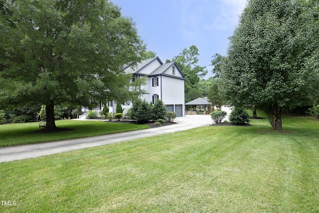 4217 Grahamstone Rd, Raleigh, NC 27610 - view of front of house featuring a front lawn, a garage, and concrete driveway