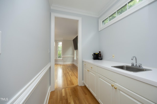 4217 Grahamstone Rd, Raleigh, NC 27610 - bar with light wood-style flooring and ornamental molding