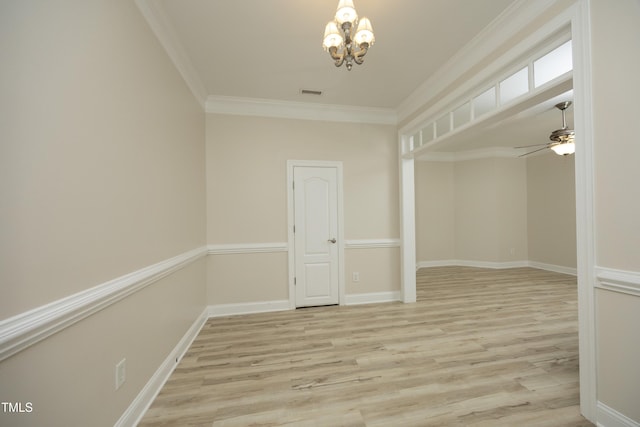 4217 Grahamstone Rd, Raleigh, NC 27610 - empty room featuring a chandelier, ornamental molding, wood finished floors, and ceiling fan