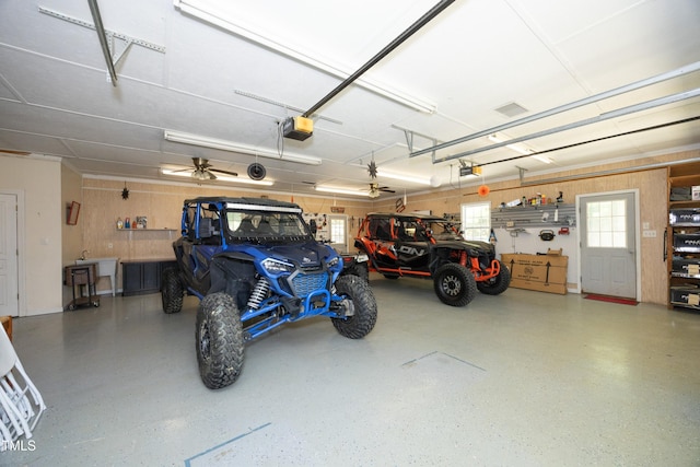 4217 Grahamstone Rd, Raleigh, NC 27610 - garage with a garage door opener and wooden walls