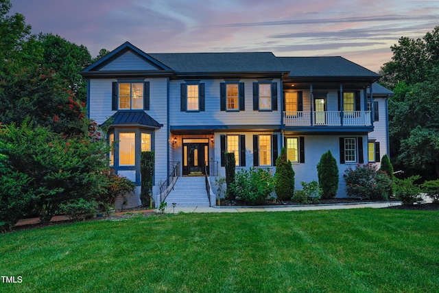 4217 Grahamstone Rd, Raleigh, NC 27610 - view of front facade featuring a front lawn and a balcony