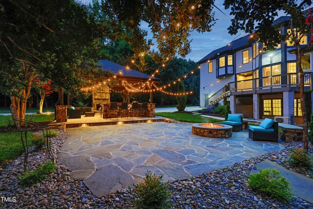 4217 Grahamstone Rd, Raleigh, NC 27610 - view of patio with a wooden deck, an outdoor living space with a fire pit, and stairway