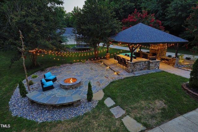 4217 Grahamstone Rd, Raleigh, NC 27610 - view of grassy yard featuring an outdoor fire pit, a gazebo, and a patio area