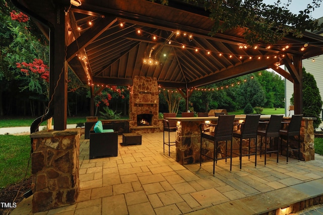 4217 Grahamstone Rd, Raleigh, NC 27610 - view of patio featuring a gazebo and an outdoor stone fireplace