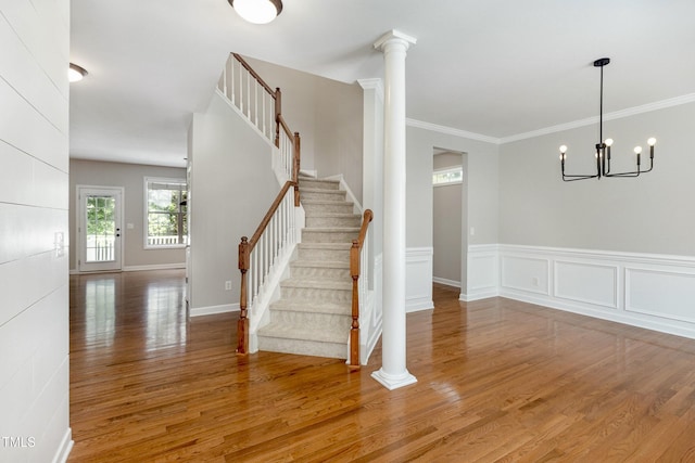 1304 Trailing Rose Ct, Wake Forest, NC 27587 - staircase with wood finished floors, a chandelier, and ornamental molding