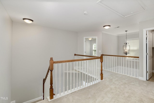 1304 Trailing Rose Ct, Wake Forest, NC 27587 - hall with attic access, carpet, an upstairs landing, and crown molding