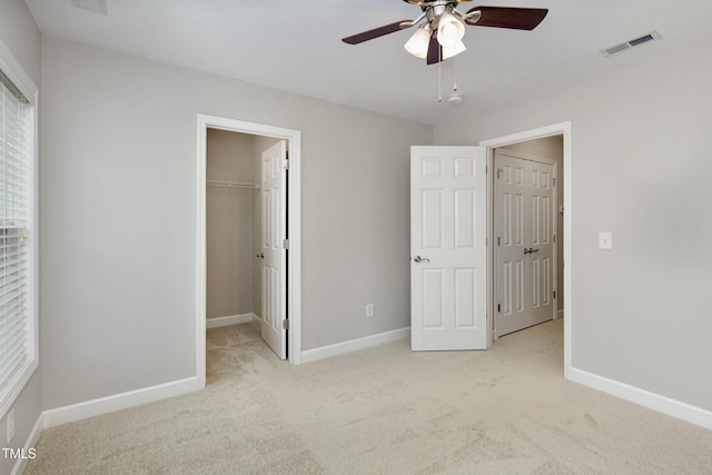 1304 Trailing Rose Ct, Wake Forest, NC 27587 - unfurnished bedroom with a walk in closet, carpet flooring, ceiling fan, and a closet
