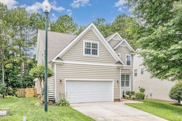 1304 Trailing Rose Ct, Wake Forest, NC 27587 - traditional home with concrete driveway, an attached garage, and roof with shingles