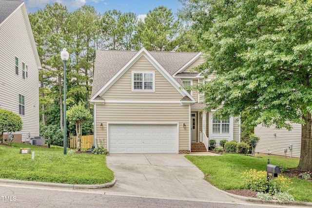 1304 Trailing Rose Ct, Wake Forest, NC 27587 - traditional-style house featuring driveway, a front lawn, a shingled roof, and an attached garage