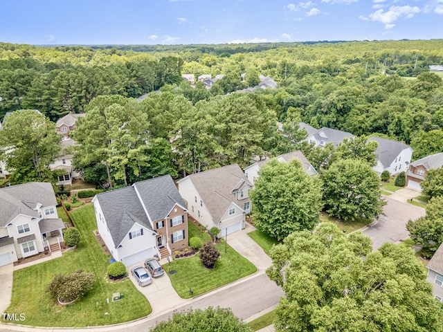 1304 Trailing Rose Ct, Wake Forest, NC 27587 - aerial perspective of suburban area featuring a heavily wooded area