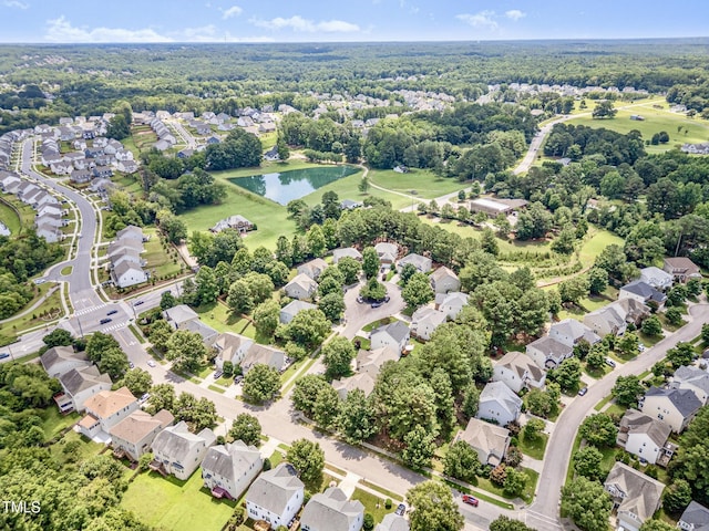 1304 Trailing Rose Ct, Wake Forest, NC 27587 - aerial perspective of suburban area featuring a nearby body of water and a heavily wooded area