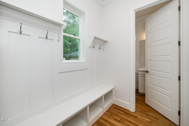 905 Deboy St, Raleigh, NC 27606 - mudroom with light wood-style flooring and crown molding