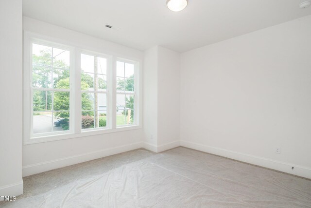 905 Deboy St, Raleigh, NC 27606 - spare room featuring light colored carpet and baseboards