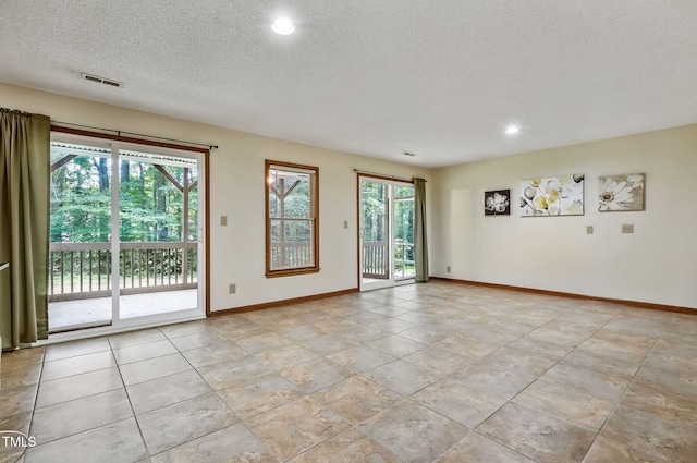 311 Westbrook Dr, Carrboro, NC 27510 - spare room featuring a textured ceiling and recessed lighting