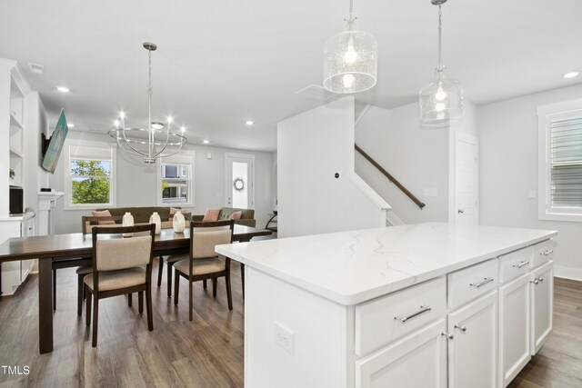 513 Basin Hill Dr, Wake Forest, NC 27587 - kitchen with wood finished floors, open floor plan, a chandelier, recessed lighting, and a center island