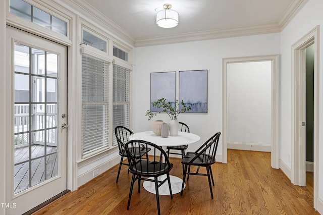 1217 Chalk Maple Dr, Cary, NC 27519 - dining space with ornamental molding, healthy amount of natural light, and light wood-style floors