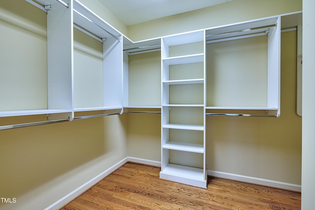 1217 Chalk Maple Dr, Cary, NC 27519 - walk in closet with wood finished floors