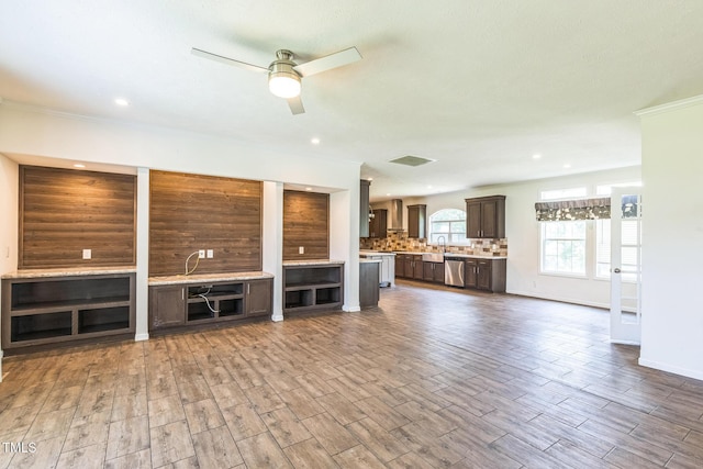 589 Atkinson Mill Rd, Selma, NC 27576 - unfurnished living room featuring wood finished floors, ceiling fan, crown molding, and recessed lighting
