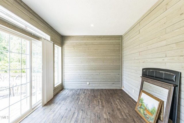 589 Atkinson Mill Rd, Selma, NC 27576 - unfurnished sunroom featuring wood walls and wood-type flooring