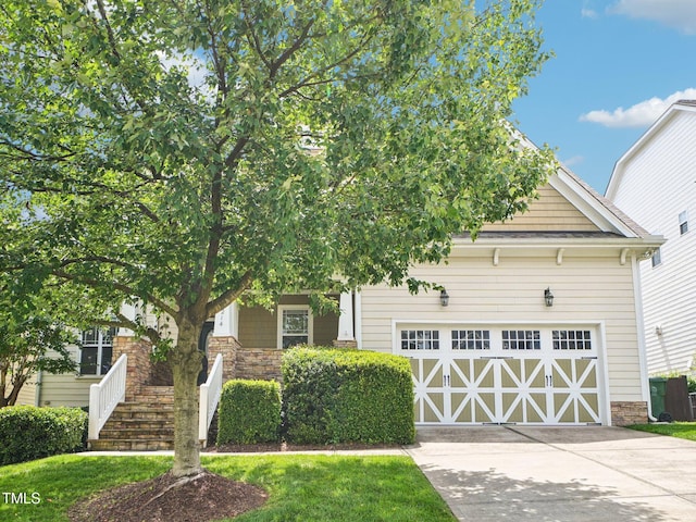 214 Ashdown Forest Ln, Cary, NC 27519 - view of property hidden behind natural elements featuring a garage and driveway