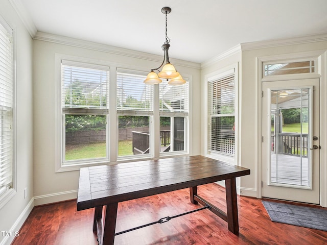 214 Ashdown Forest Ln, Cary, NC 27519 - unfurnished dining area featuring plenty of natural light, wood finished floors, and crown molding