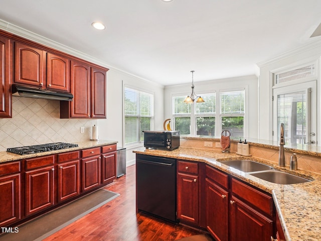 214 Ashdown Forest Ln, Cary, NC 27519 - kitchen featuring dishwashing machine, gas stovetop, reddish brown cabinets, under cabinet range hood, and ornamental molding