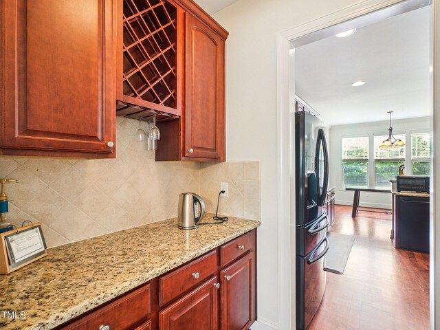 214 Ashdown Forest Ln, Cary, NC 27519 - kitchen with fridge with ice dispenser, light stone countertops, backsplash, pendant lighting, and recessed lighting