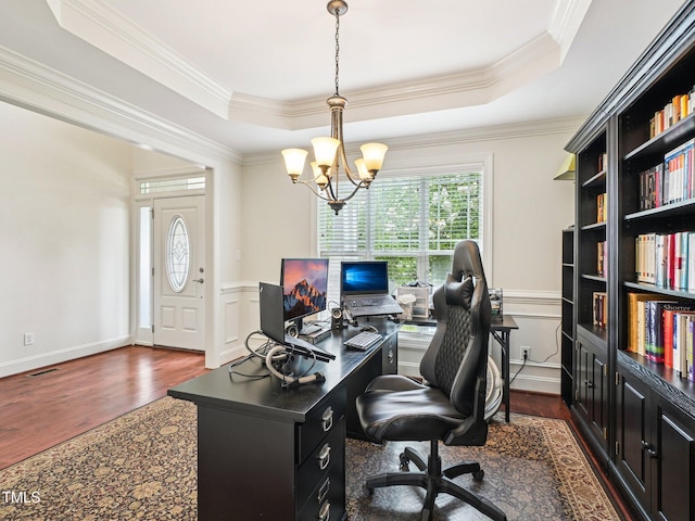 214 Ashdown Forest Ln, Cary, NC 27519 - office space with dark wood-style floors, a raised ceiling, a chandelier, ornamental molding, and a wainscoted wall