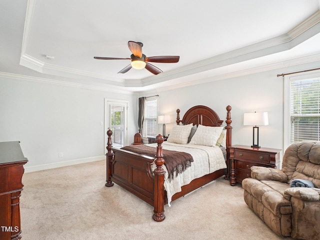 214 Ashdown Forest Ln, Cary, NC 27519 - bedroom with a tray ceiling, ornamental molding, light colored carpet, and a ceiling fan