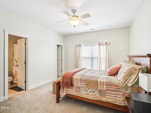 214 Ashdown Forest Ln, Cary, NC 27519 - carpeted bedroom featuring ensuite bath and a ceiling fan
