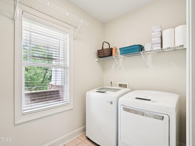 214 Ashdown Forest Ln, Cary, NC 27519 - laundry area featuring washer and dryer and light tile patterned floors