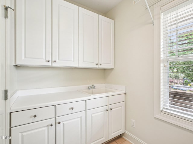 214 Ashdown Forest Ln, Cary, NC 27519 - laundry room with a sink and light tile patterned floors