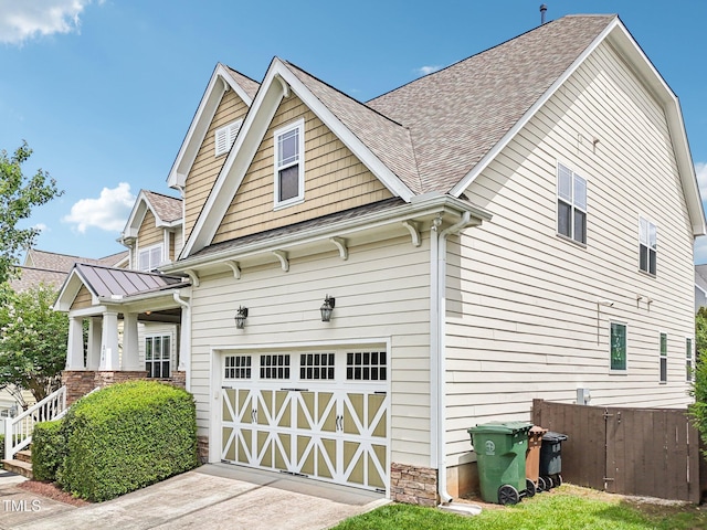 214 Ashdown Forest Ln, Cary, NC 27519 - view of property exterior featuring an attached garage, concrete driveway, and a shingled roof