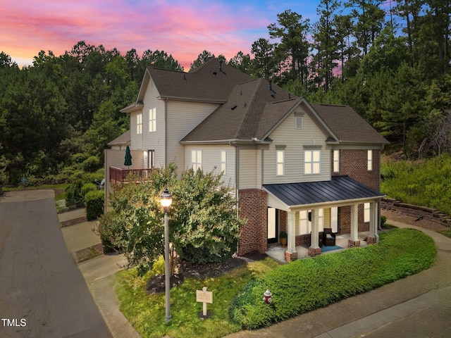 9908 Jerome Ct, Raleigh, NC 27617 - view of front facade featuring brick siding and roof with shingles